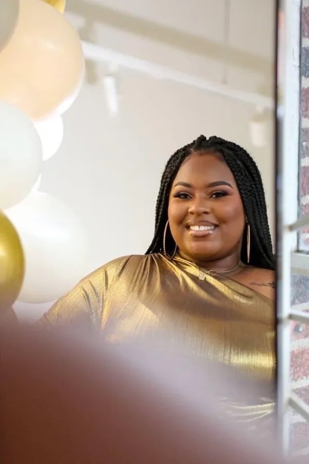 Golden dress portrait with balloons