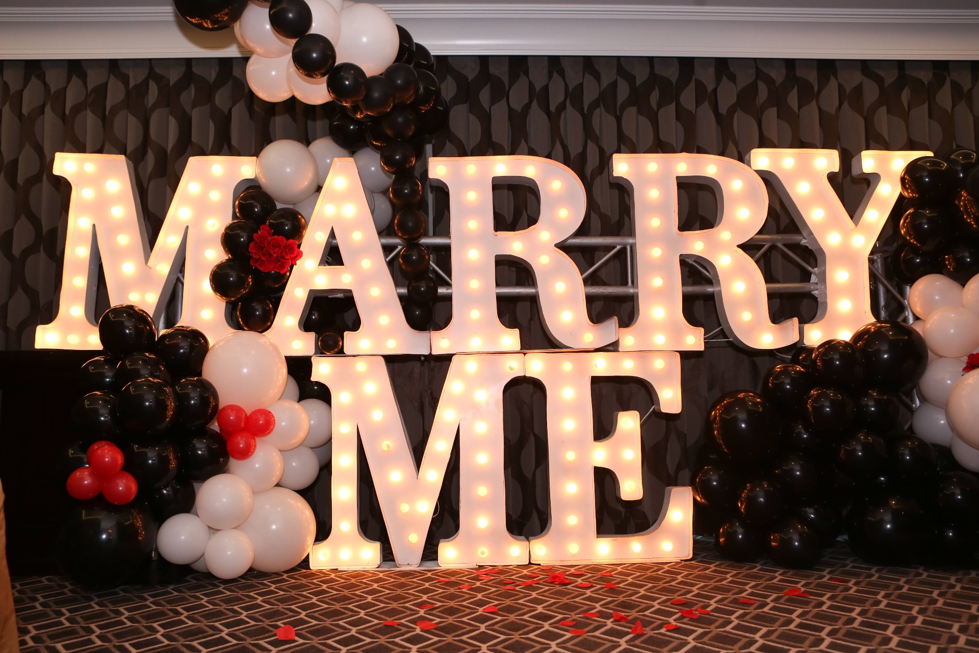 MARRY ME marquee sign with elegant balloon arch